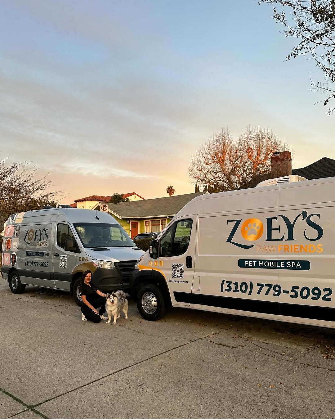 Zoeys Paw Friends mobile pet grooming vans parked outside during a sunset in Los Angeles, California.